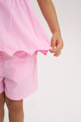 Short Rosa con bolsillo ondeado