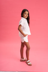 Short marfil con bolsillo festoneado